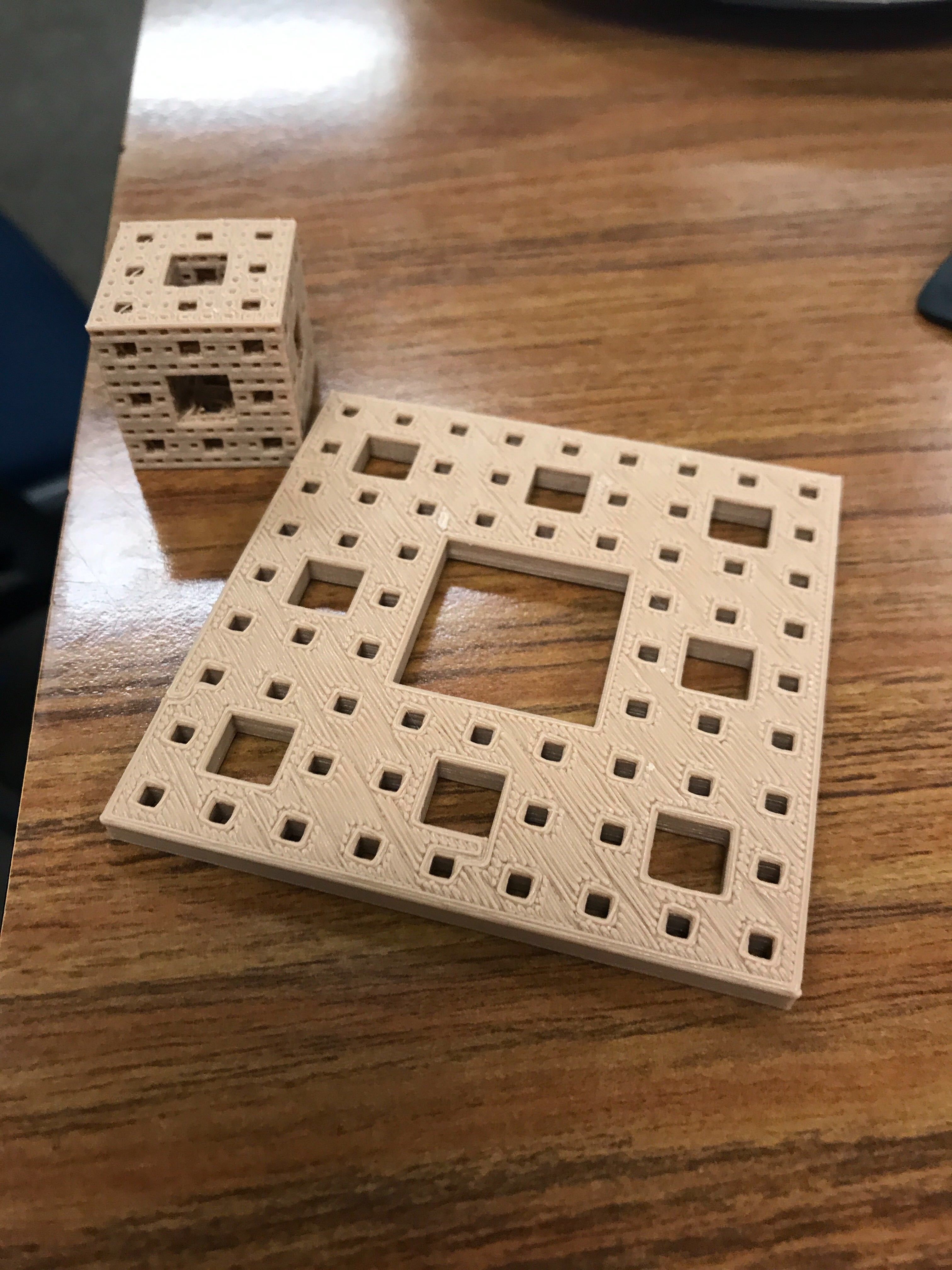Merger sponge and fractal carpet